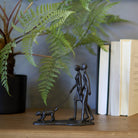 Dog Walking Couple Sculpture
