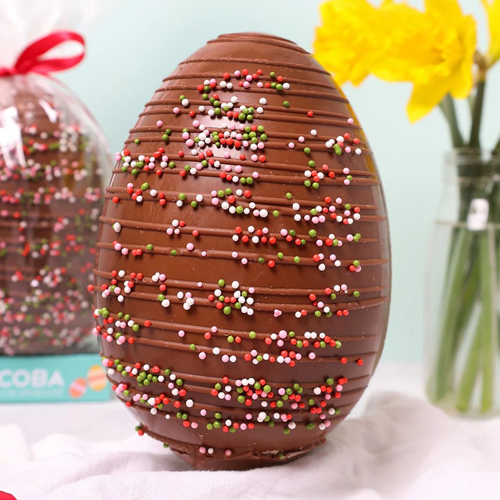 Milk chocolate drizzled Easter egg with coloured sprinkles 250g