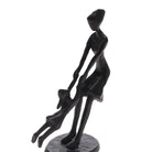 Mother Spinning Child Sculpture