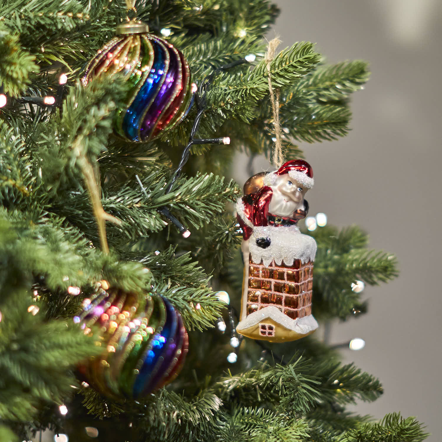 Santa Climbing Down the Chimney Shaped Bauble