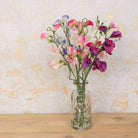 Sweet Peas in Vintage Bottle