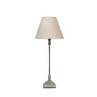 Thin stem table lamp with natural shade